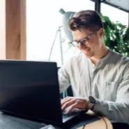 happy man analysing forex charts